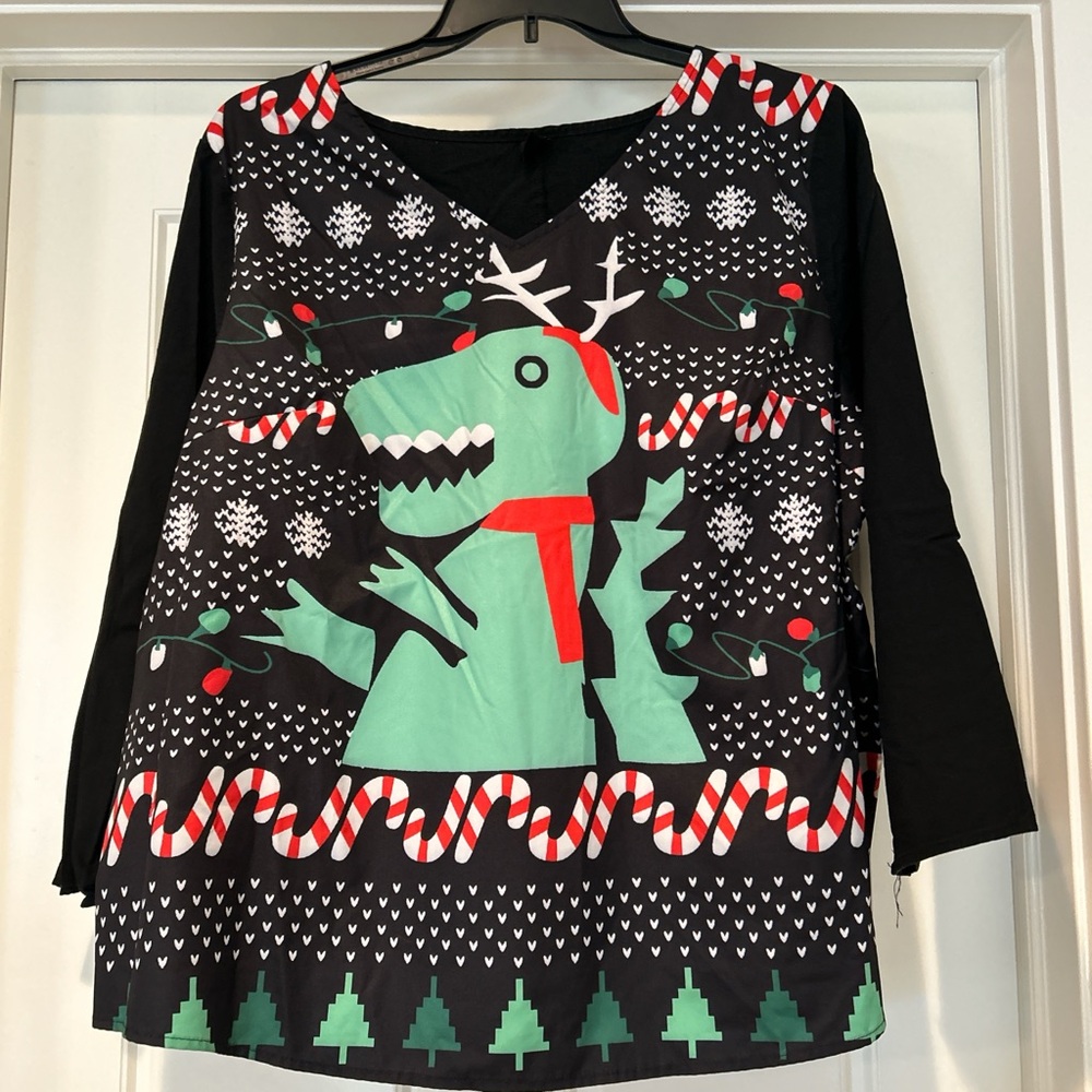 Dinosaur blouse-smaller 4x and front fabric is not stretchy at all-more silky.
